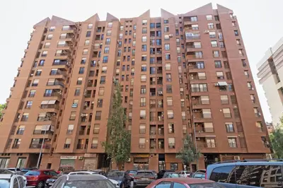 a tall building with cars parked in front of it at GuestReady - Lovely stay in the Algirós area in Valencia