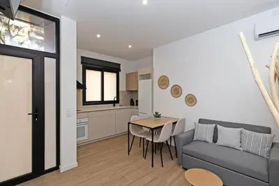a living room with a couch and a table at GuestReady - Lovely stay in the Algirós area in Valencia