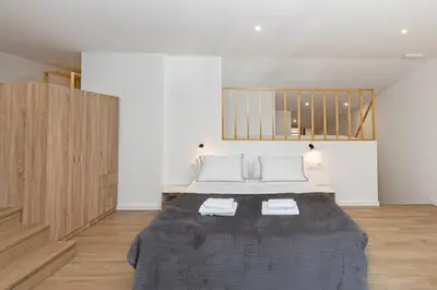 a bedroom with a bed with two towels on it at GuestReady - Beautiful loft in Valencia in Valencia