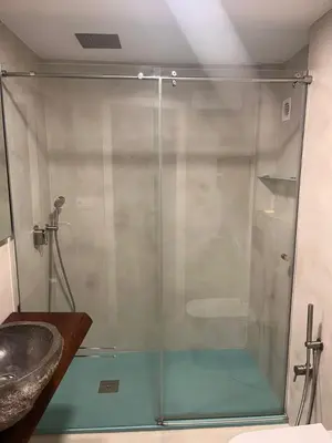 a glass shower in a bathroom with a sink at Tranquil Coastal Living in Puebla de Farnals