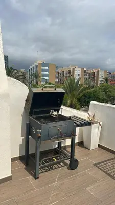 a grill sitting on top of a roof at Tranquil Coastal Living in Puebla de Farnals