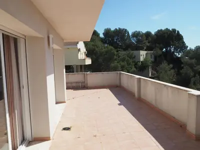 a balcony with a view of a building at Brisas de Sierra Calderona in Gilet