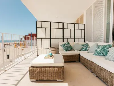 a living room with a couch and a view of the beach at Marsalada 2 - Apartment with sea view in Playa de Mar