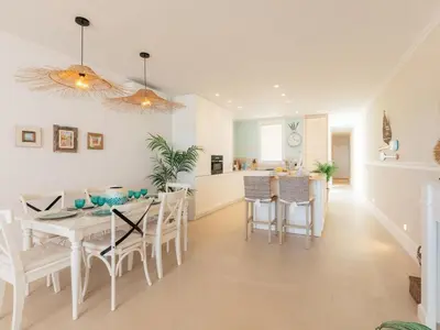 a dining room and kitchen with a table and chairs at Marsalada 2 - Apartment with sea view in Playa de Mar