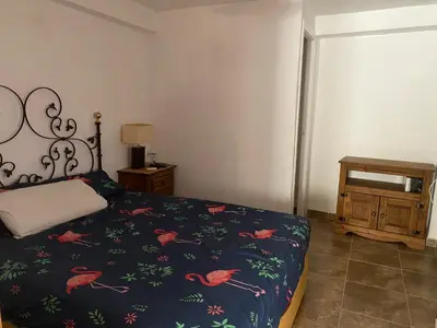 a bedroom with a bed with a bedspread with birds on it at Casa Altura in Altura