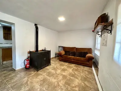 a living room with a couch and a fireplace at Casa Altura in Altura