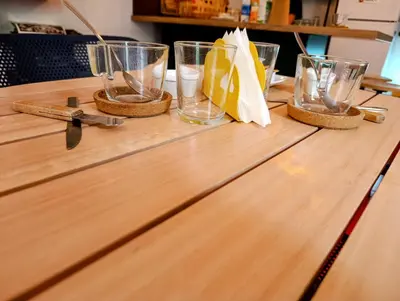 a wooden table with glasses and a pair of scissors at B&B Una Habitación Propia in Valencia