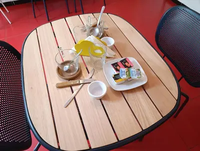 a wooden table with a plate of food on it at B&B Una Habitación Propia in Valencia
