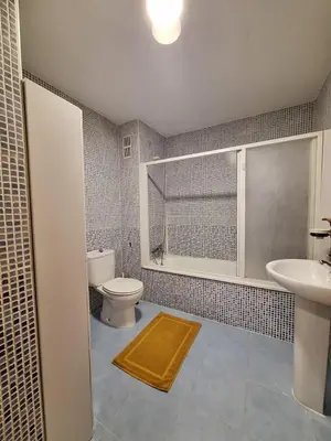 a bathroom with a toilet and a sink at Townhouse with pool next to the City of Arts in Valencia