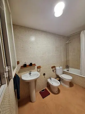 a bathroom with a toilet and a sink at Townhouse with pool next to the City of Arts in Valencia