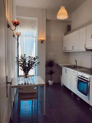 a kitchen with a table and a dining room at Welcome to your Home in Valencia