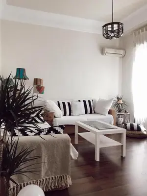a living room with a white couch and a table at Welcome to your Home in Valencia