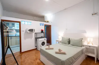 a bedroom with a bed with two towels on it at Loft Economico Cerca del Centro 1 Domitorio y Sofa cama 4pax AC in Valencia