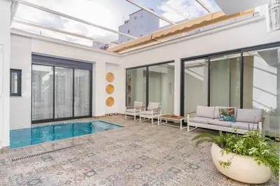 a living room with a swimming pool and a house at Invalencia - Visitacion Pool House in Valencia
