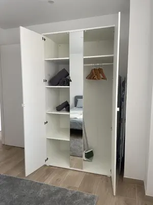 a room with white walls and a closet at More than a lovely flat in Godella