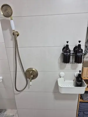 a bathroom with a shower with a shower head at Beach and City Valencia in Valencia