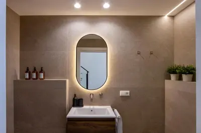a bathroom with a sink and a mirror at Boutique Room - One Tower in Valencia