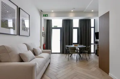 a living room with a couch and a table at Boutique Room - One Tower in Valencia