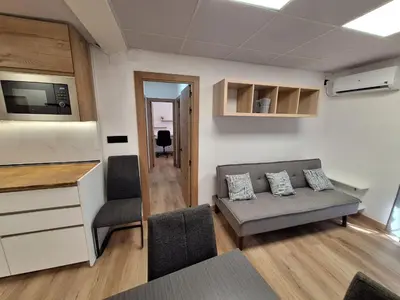 a living room with a couch and a table at Piso Burjassot - Valencia in Burjasot