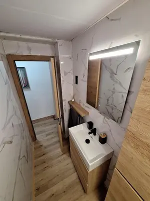 a bathroom with a white sink and a mirror at Piso Burjassot - Valencia in Burjasot