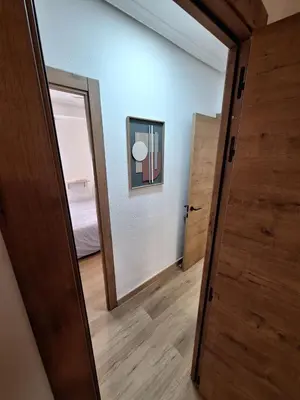 a room with a hallway with a door and a mirror at Piso Burjassot - Valencia in Burjasot