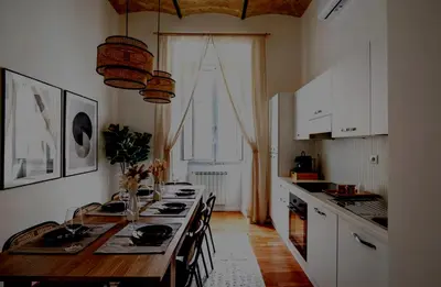 a kitchen with a long wooden table with chairs at Apartamento Aleyda in Valencia