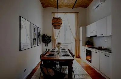 a kitchen with a table and chairs in a room at Apartamento Aleyda in Valencia