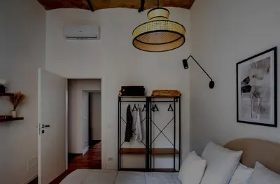 a living room with a bed and a lamp at Apartamento Aleyda in Valencia