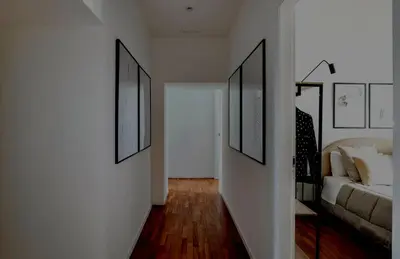a living room with a couch and pictures on the wall at Apartamento Aleyda in Valencia