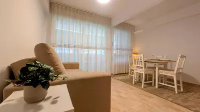 a living room with a couch and a table at Apartment Sibi Cullera in Cullera