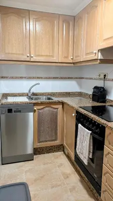 a kitchen with a sink and a dishwasher at Apartment Sibi Cullera in Cullera