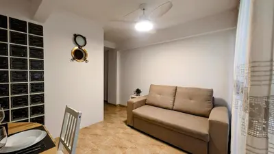 a living room with a couch and a table at Apartment Sibi Cullera in Cullera