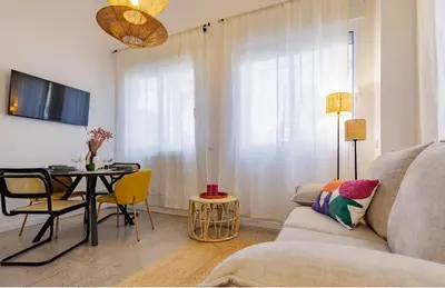 a living room with a couch and a table at Naturaloft in Valencia