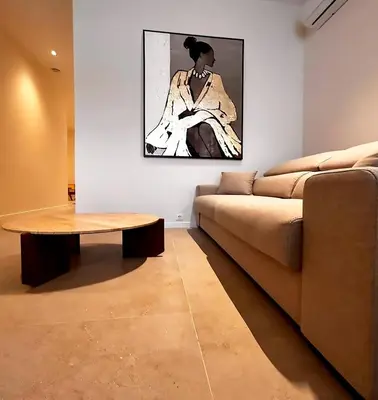 a living room with a couch and a table at Pivote Flats-Puerto B in Valencia