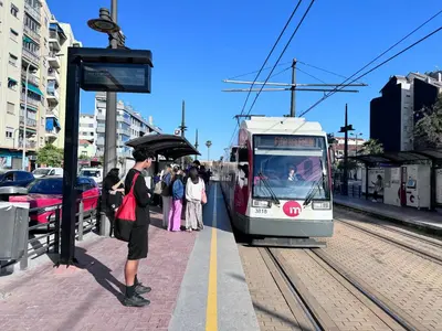 a man holding an umbrella at a train station at Estudio en Valencia in Valencia