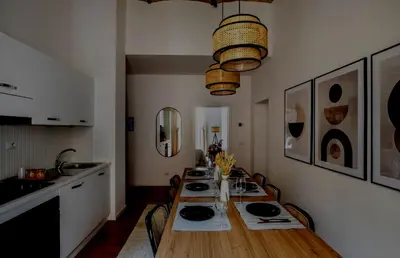 a dining room with a long table with chairs at Apartamento Aleyda in Valencia