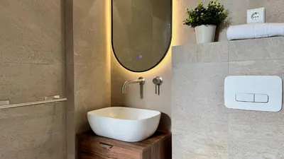 a bathroom with a white sink and a mirror at Boutique Room - Plaza Tower in Valencia