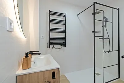 a bathroom with a sink and a shower at GuestReady - Lovely family home in El Cabanyal in Valencia