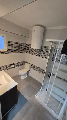 a bathroom with a toilet and a sink at Apartamento Musical in Cullera