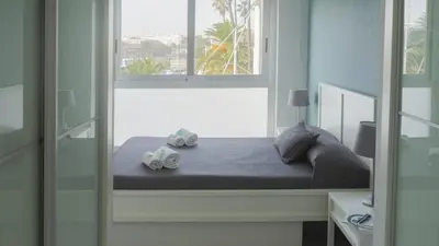 a bedroom with a bed with two speakers on it at El Coso in Valencia