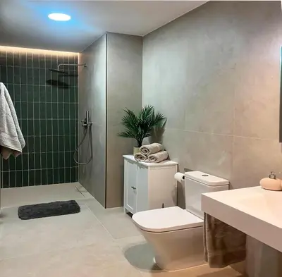 a bathroom with a toilet and a shower and a sink at Apartamento Estilo in Valencia