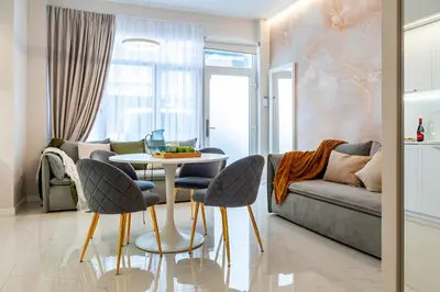 a living room with a couch and a table and chairs at Era Deluxe Near The Beach City Of in Valencia