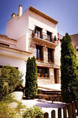 a large building with trees in front of it at El Rincon De Jara in Caudiel