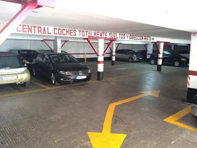 a parking garage with cars parked in it at Nautic, 4-I in Cullera