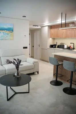 a living room with a couch and a table at Sucro Playa Apartment in Cullera