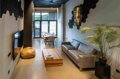 a living room with a couch and a table at Loft céntrico, 60 m2 ideal para familias pequeñas in Valencia