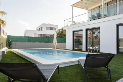 a swimming pool in the backyard of a house at Casa Blanca - Villa con piscina in Chiva
