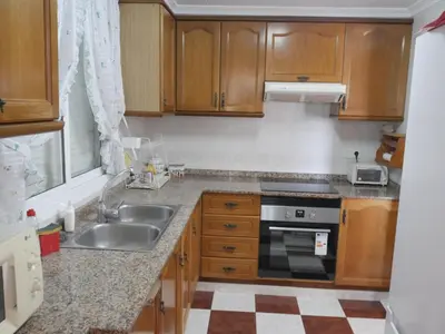 a kitchen with a sink and a stove at Navarrete, 4-20 in Cullera