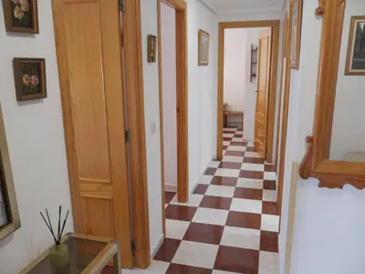 a hallway with a checkered floor in a house at Navarrete, 4-20 in Cullera