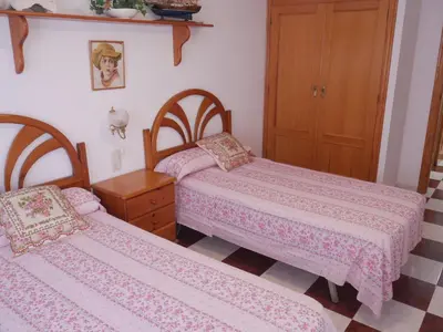 two beds in a small room with pink sheets at Navarrete, 4-20 in Cullera